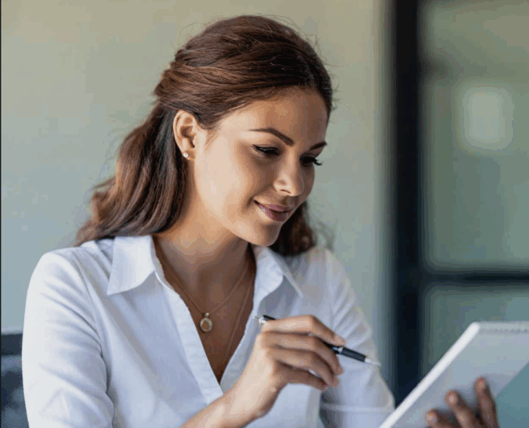 Women looking at notepad setting goals